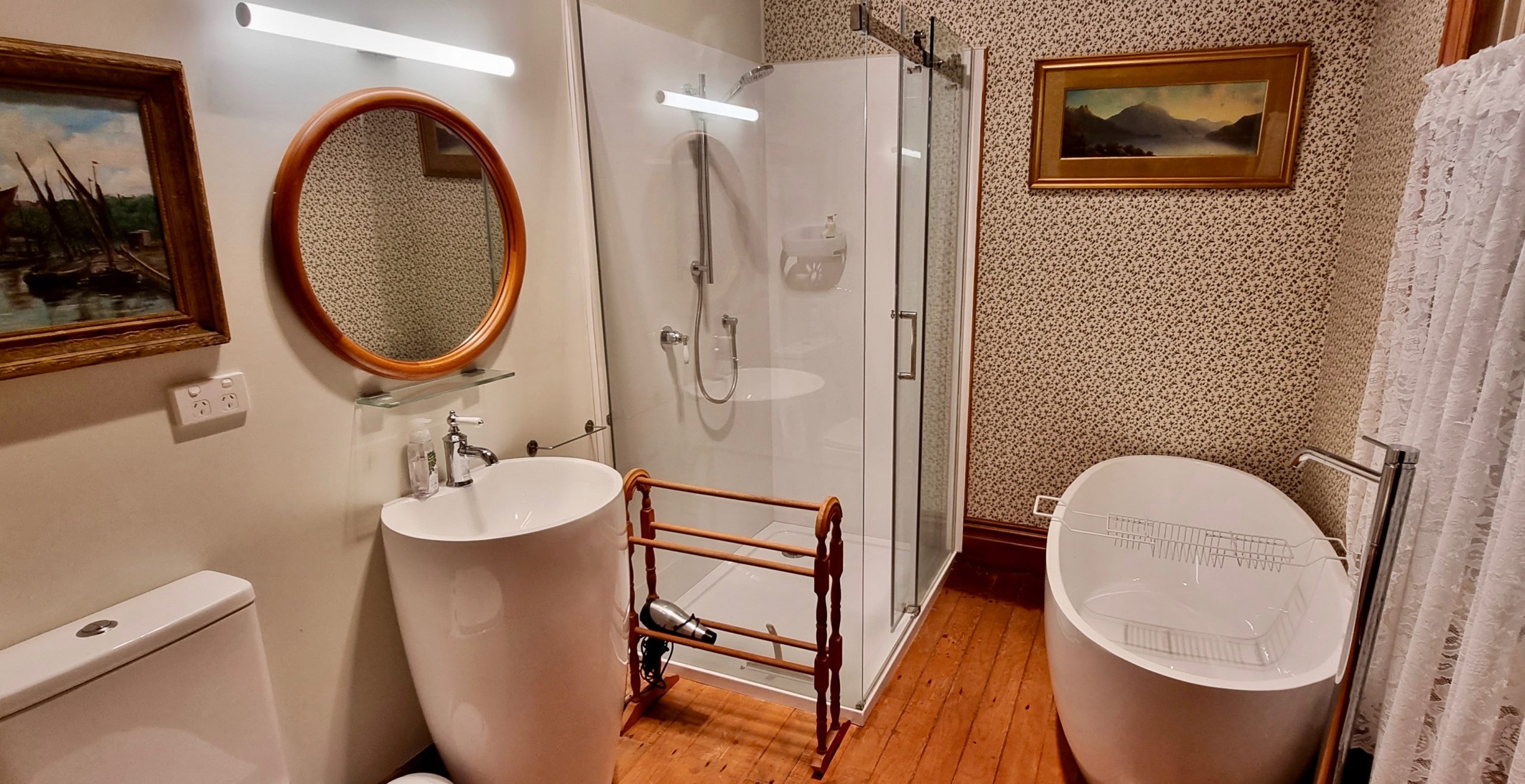 Our favourite ensuite with oils of Queenstown's Lake Wakatipu