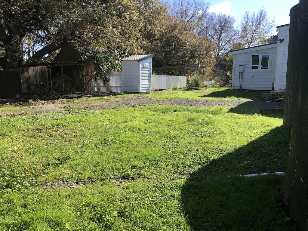 The parking yard prior to sealing The yard before the shed and toilet